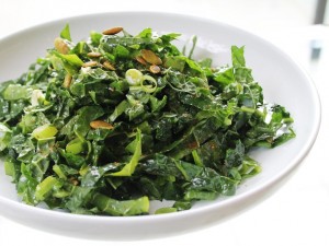 kale salad with pumpkin seeds and golden raisins